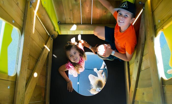 Our play area is home to tall tower and there's lots of excitement when climbing through it.